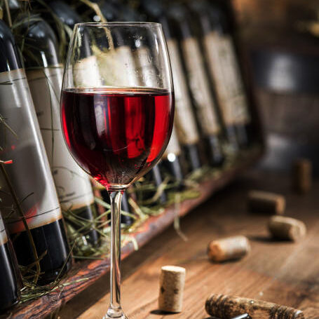 Wine bottles on the wooden shelf. 現物資産